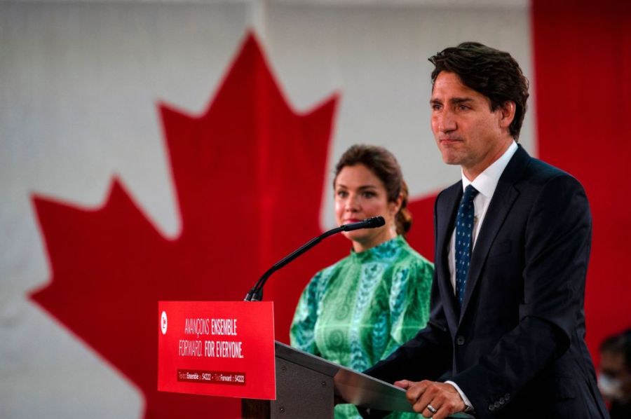 Canadian Prime Minister Justin Trudeau, flanked by wife Sophie Gregoire-Trudeau, delivers his victory speech after general elections at the Fairmount Queen Elizabeth Hotel in Montreal, Quebec, early on September 21, 2021. (ANDREJ IVANOV/AFP via Getty Images)