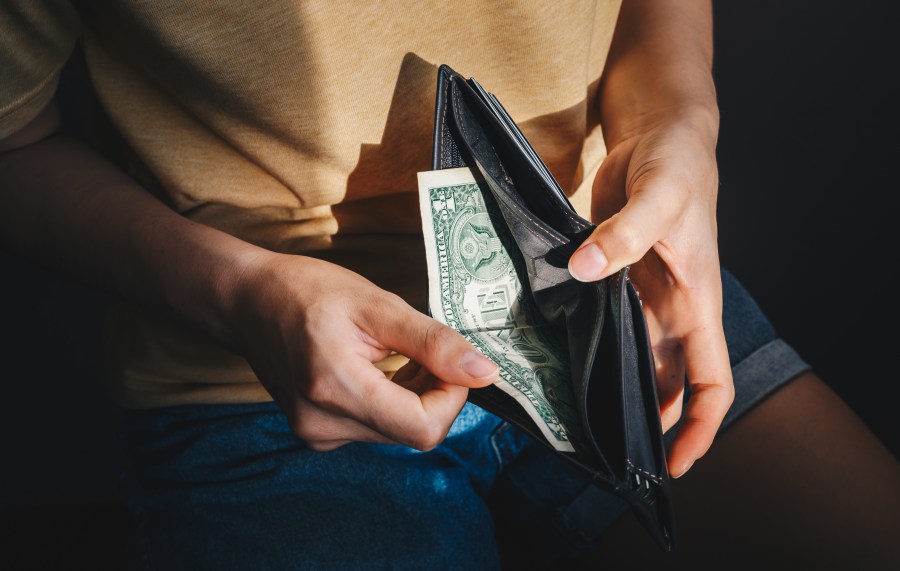 File photo of person looking in wallet. (Getty Images)