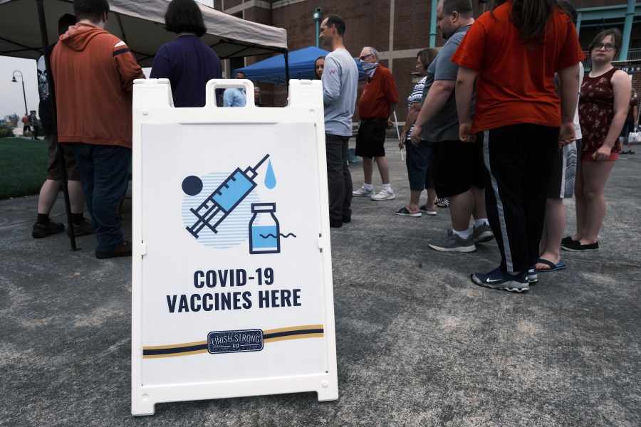 People wait to get vaccinated against COVID-19 at a baseball game on Aug. 5, 2021 in Springfield, Missouri. (Spencer Platt/Getty Images)