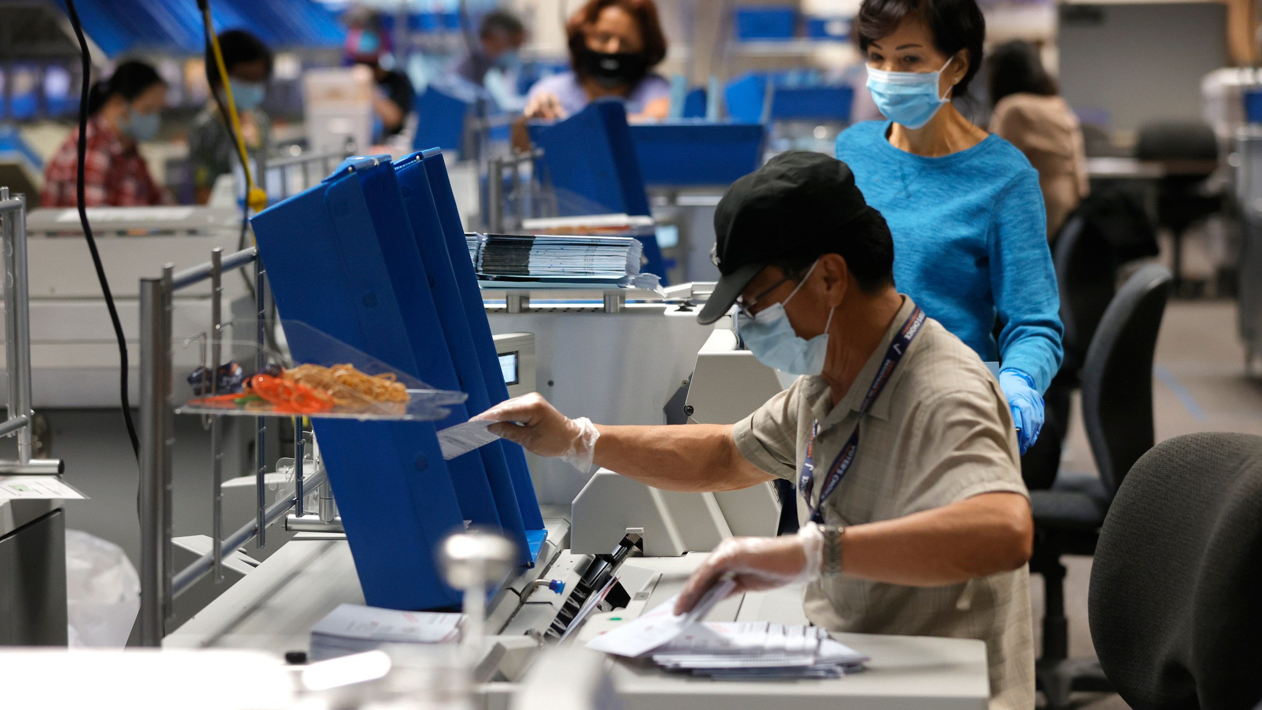 Workers sort through mail-in-ballots at the Santa Clara County registrar of voters office on Aug. 25, 2021 in San Jose, California. (Justin Sullivan/Getty Images)