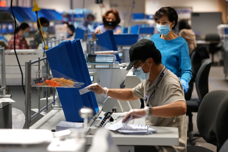 Workers sort through mail-in-ballots at the Santa Clara County registrar of voters office on Aug. 25, 2021 in San Jose, California. (Justin Sullivan/Getty Images)