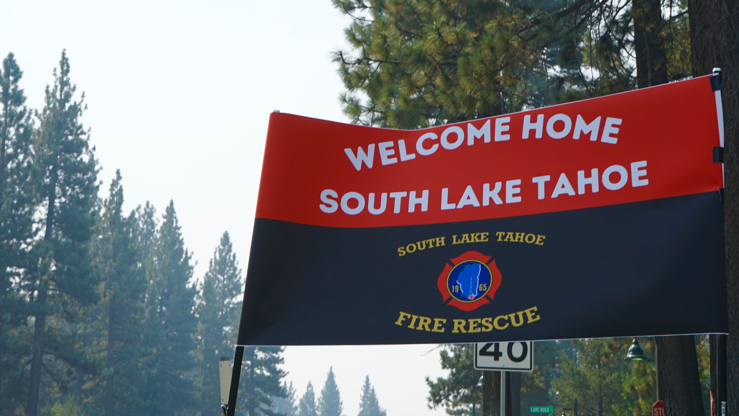 A sign outside a South Lake Tahoe Fire Station welcomes residents back to town after the lifting of the evacuation order Monday, Sept. 6, 2021. The resort town of some 22,000 was cleared last week due to the Caldor Fire. (AP Photo/Samuel Metz)