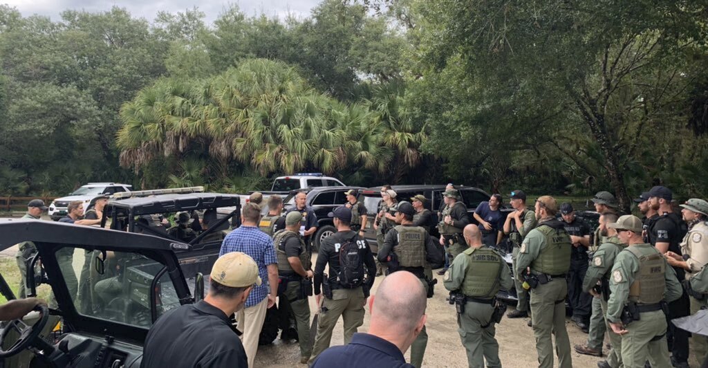 This photo provided by North Port Police Department, law enforcement officials conduct a search of the vast Carlton Reserve in the Sarasota, Fla., area for Brian Laundrie on Saturday, Sept. 18, 2021. Laundrie is a person of interest in the disappearance of his girlfriend, Gabrielle “Gabby” Petito. (North Port Police Department via AP)