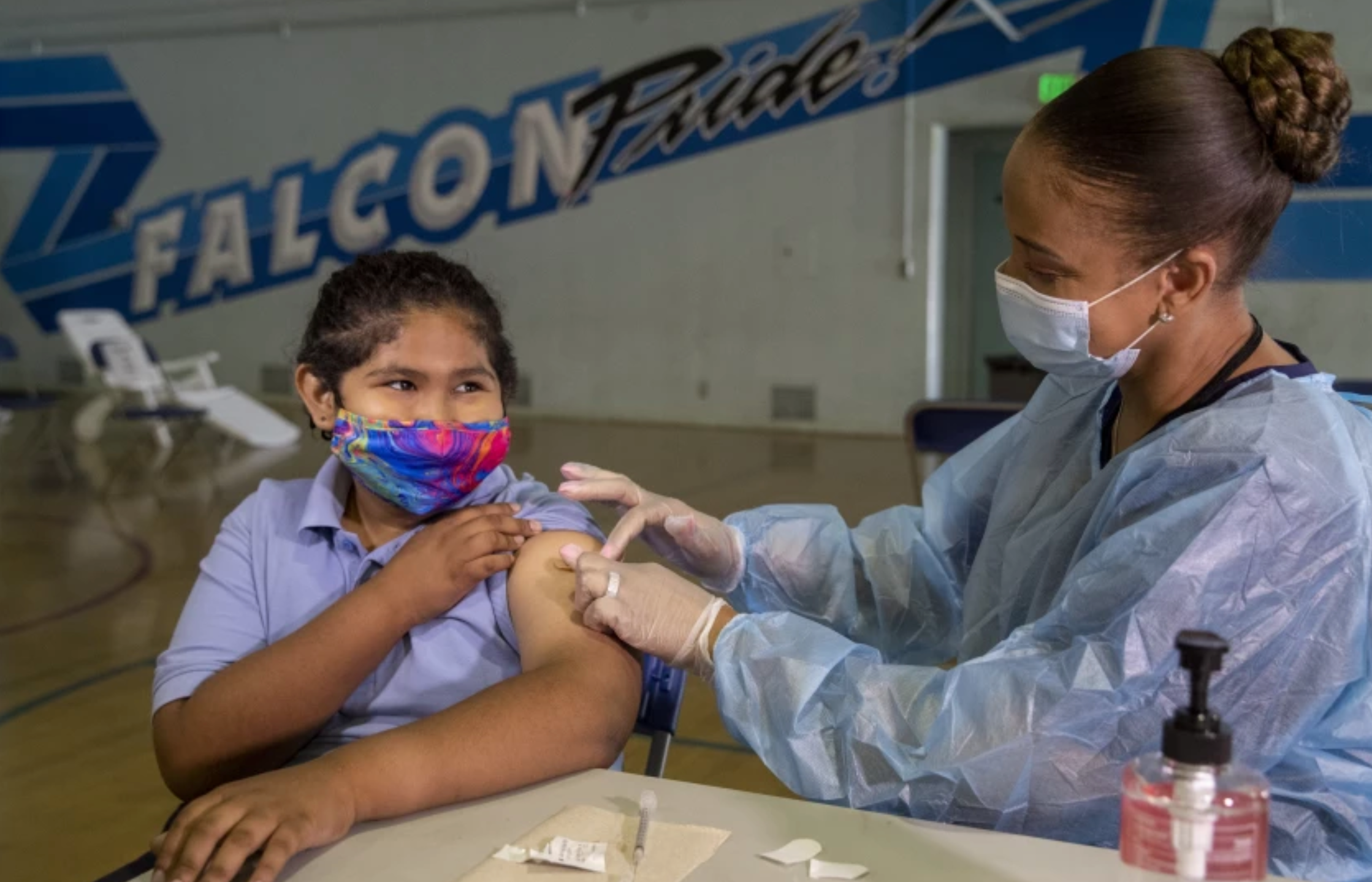 A middle school student is vaccinated against COVID-19 at San Fernando Institute of Applied Media as part of a clinic on Aug. 30, 2021. (Mel Melcon / Los Angeles Times)