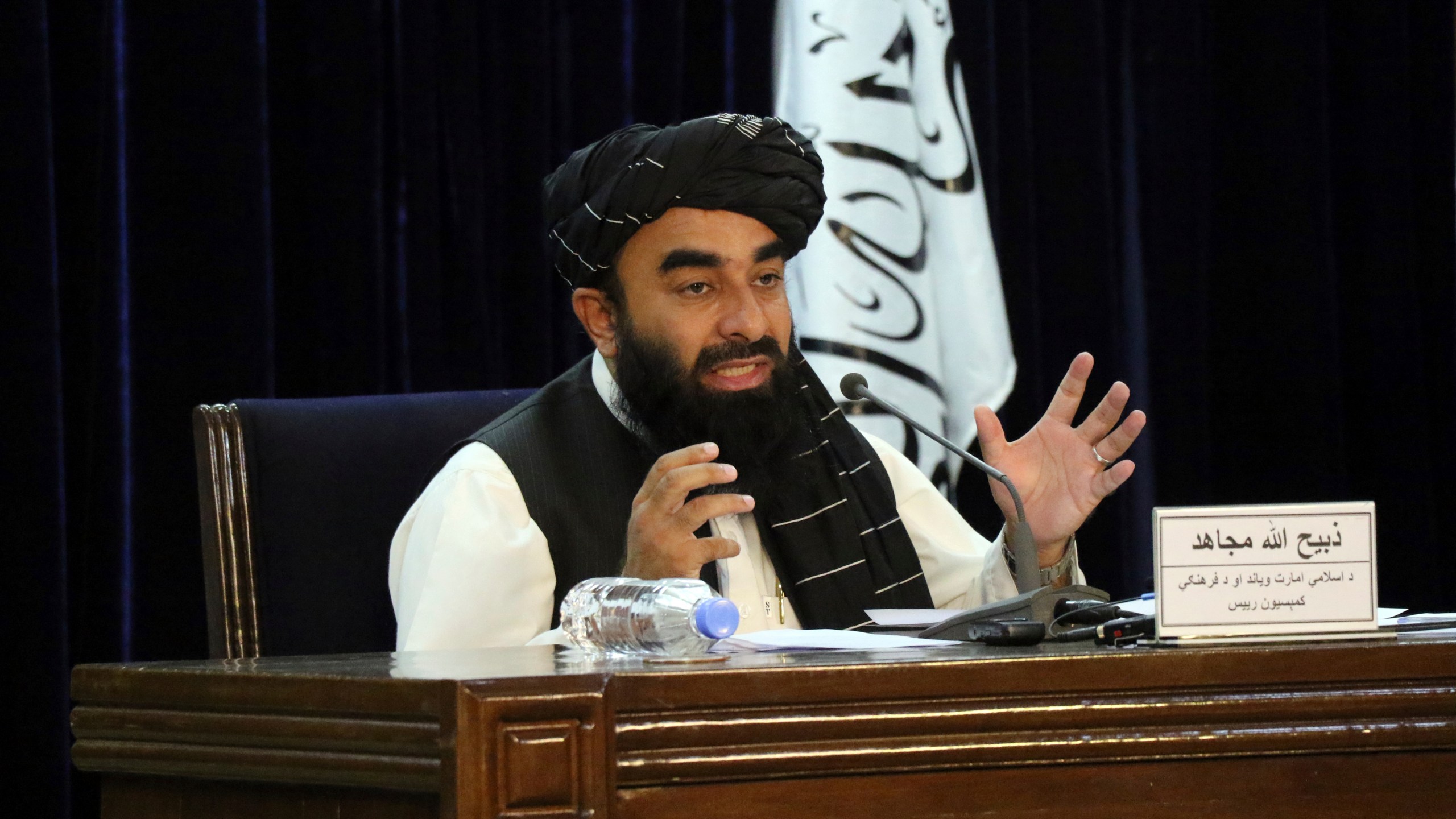 Taliban spokesman Zabihullah Mujahid speaks during a press conference in Kabul, Afghanistan Tuesday, Sept. 7, 2021. The Taliban on Tuesday announced a caretaker Cabinet stacked with veterans of their harsh rule in the late 1990s and subsequent 20-year battle against the U.S.-led coalition and its Afghan government allies. The line-up announced at the press conference is not likely to win the international support the Taliban so desperately need to avoid an economic meltdown. (AP Photo/Muhammad Farooq)