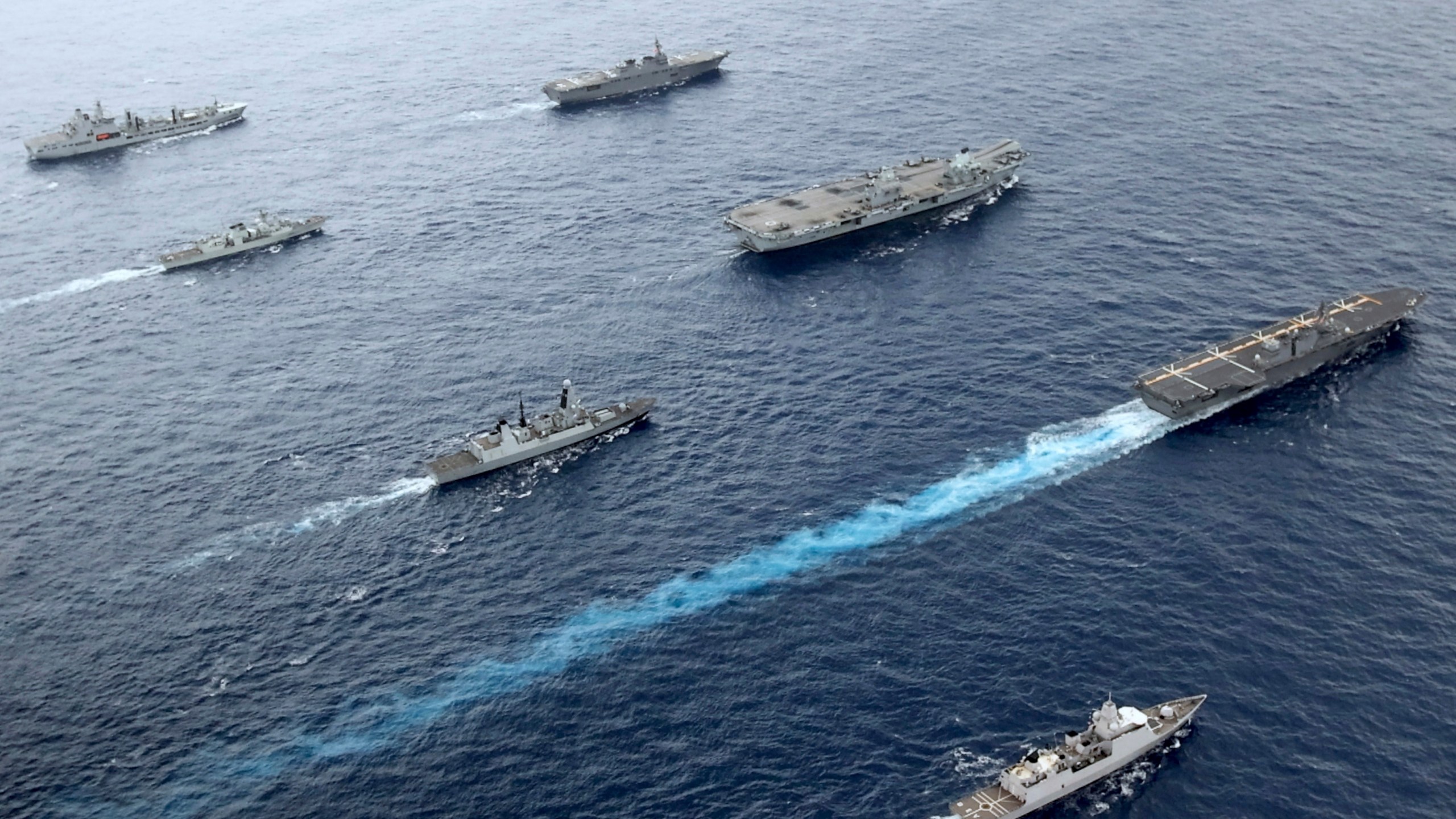 Front to back; HNLMS Evertsen, JS Izumo, HMS Defender, HMS Queen Elizabeth, HMCS Winnipeg, JS Ise, RFA Tidespring. UK Royal Navy Carrier Strike Group 21 HMS Queen Elizabeth, HMS Defender, RFA Tidespring and HNLMS Evertsen from CSG21 sails with Japanese ships JS Izumo and JS Ise along with the Canadian ship HMCS Winnipeg in the Pacific Ocean, Sept. 2021. With increasingly strong talk in support of Taiwan, a new deal to supply Australia with nuclear submarines, and the launch of a European strategy for greater engagement in the Indo-Pacific, the U.S. and its allies are becoming growingly assertive in their approach toward a rising China. (UK Ministry of Defence via AP)