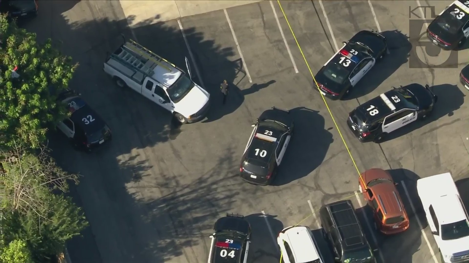 Law enforcement cars surround a pursuit vehicle following a fatal police shooting in Buena Park on Sept. 3, 2021. (KTLA)