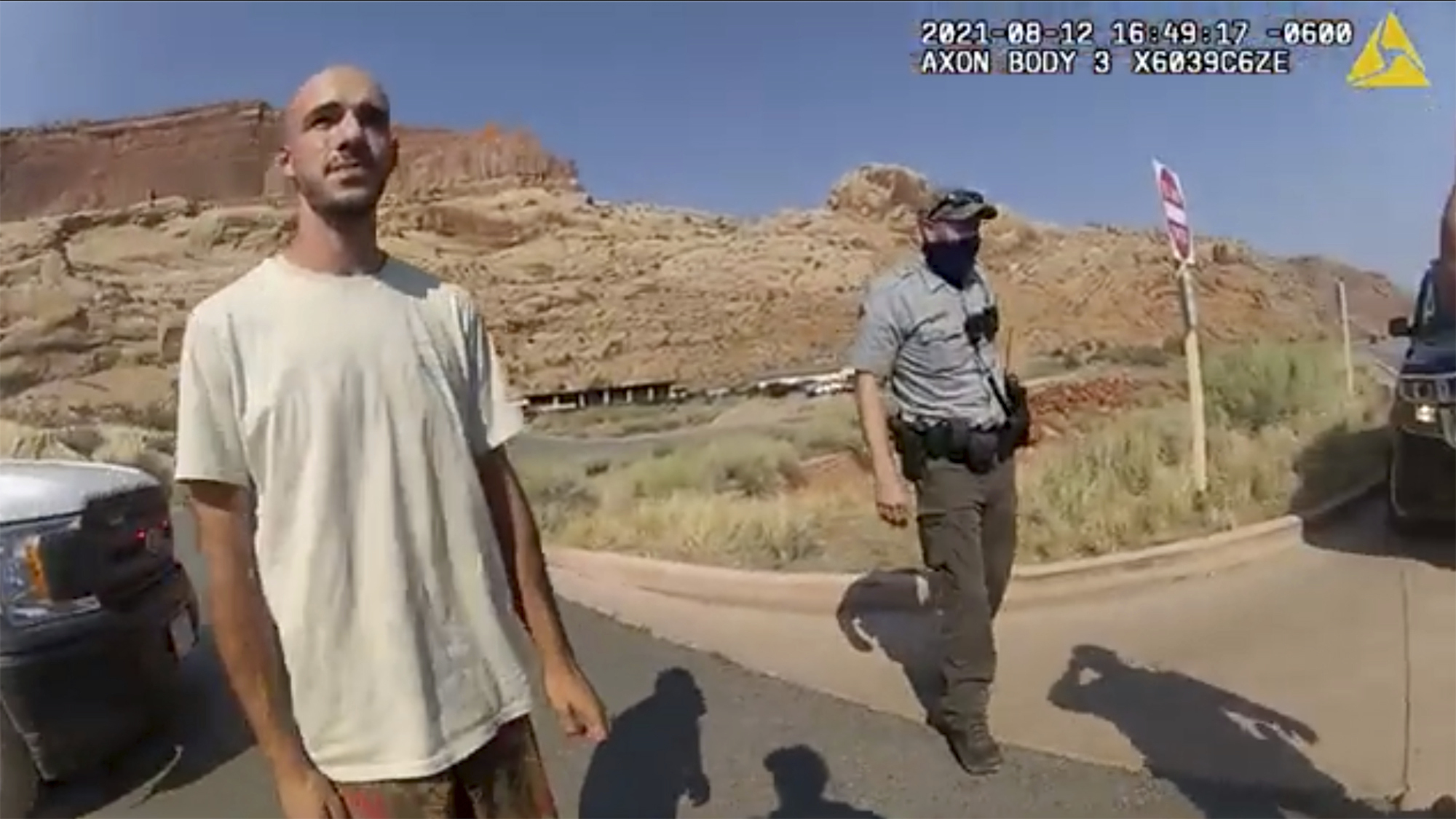 This police camera video provided by the Moab Police Department shows Brian Laundrie talking to a police officer after police pulled over the van he was traveling in with his girlfriend, Gabrielle “Gabby” Petito, near the entrance to Arches National Park on Aug. 12, 2021. The couple was pulled over while they were having an emotional fight. (The Moab Police Department via Associated Press)