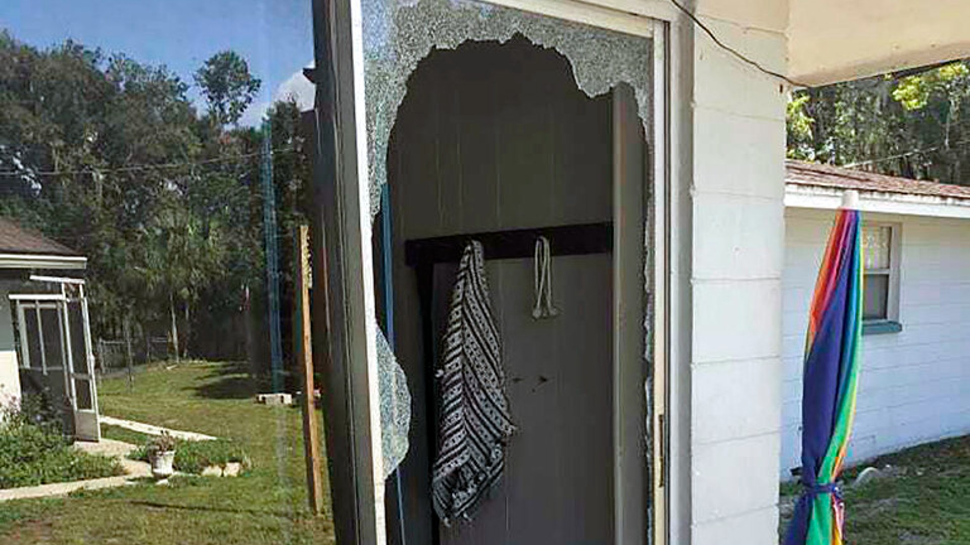 This image provided by the Polk County Sheriff's Office shows the back of the residence where a Polk sheriff's lieutenant entered the house and exchanged fire with a shooting suspect in a neighborhood in Lakeland, Fla. (Polk County Sheriff's Office via AP)