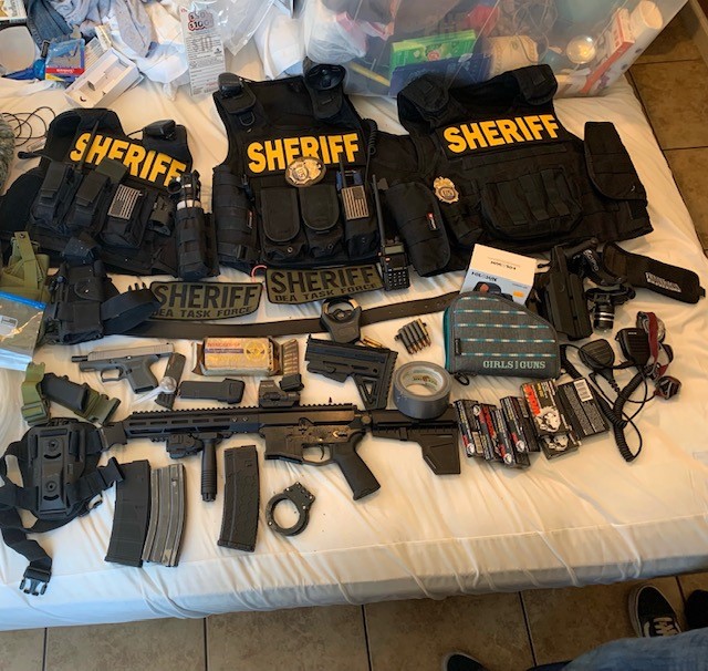 Items discovered during a search of a Hesperia motel room are shown in a photo released by the San Bernardino County Sheriff's Department on Sept. 16, 2021.