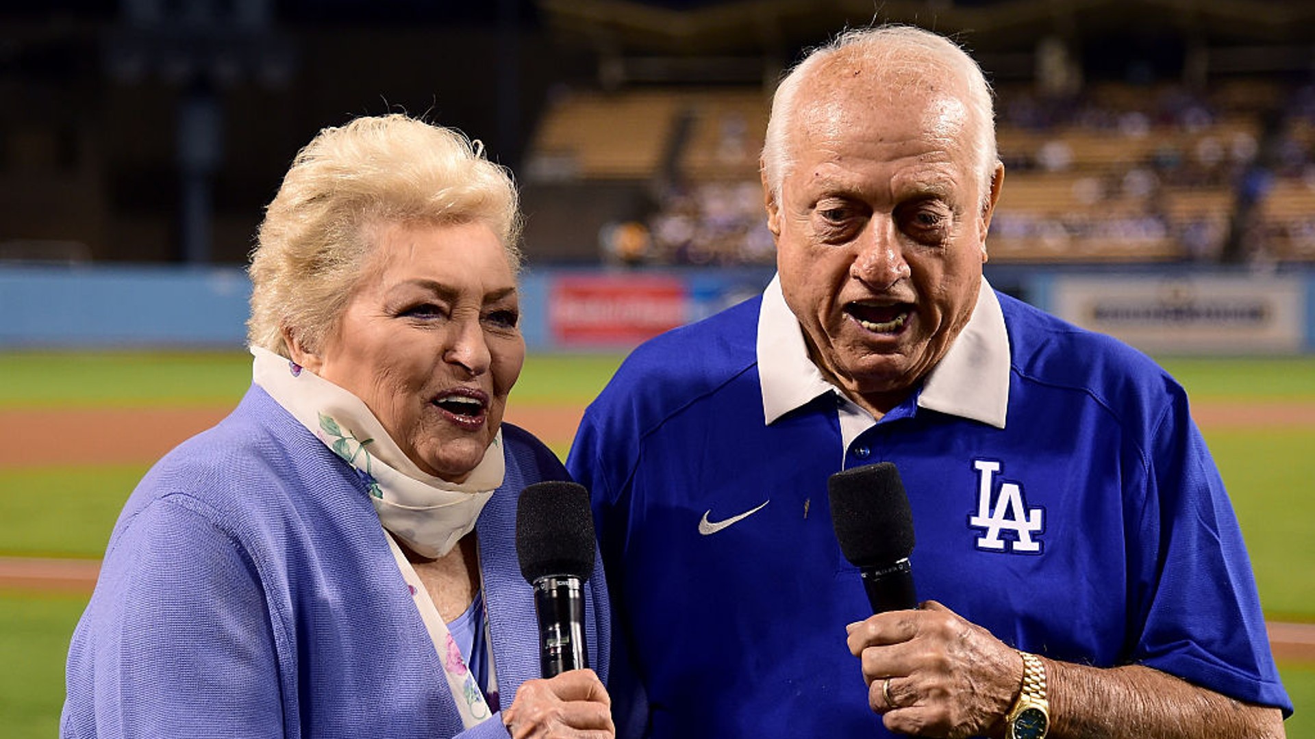 Tommy and Jo Lasorda make the "play ball" announcement on Tommy's 89th birthday, before the game between the Los Angeles Dodgers and the Colorado Rockies at Dodger Stadium on September 22, 2016 in Los Angeles, California. (Photo by Harry How/Getty Images)