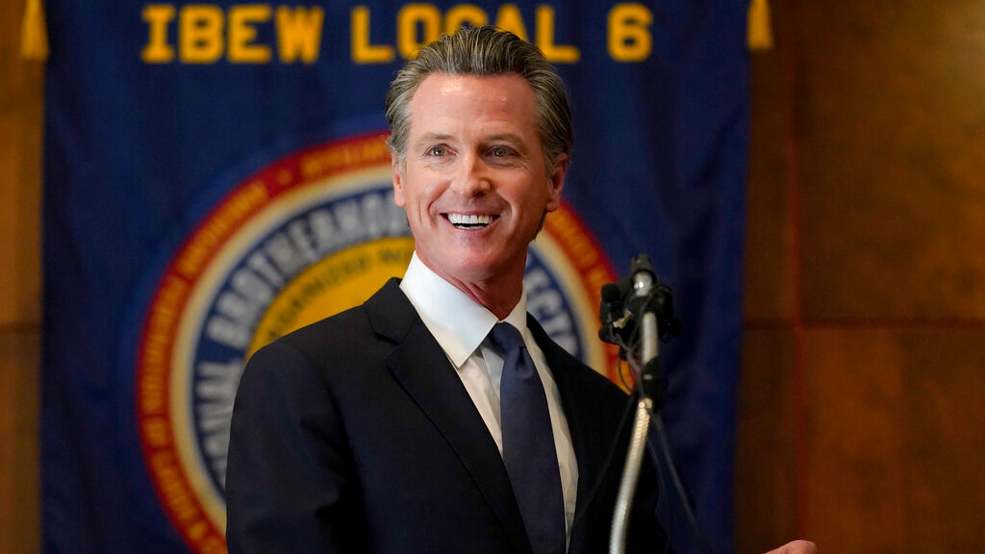 Gov. Gavin Newsom speaks to volunteers in San Francisco, Tuesday, Sept. 14, 2021. (AP Photo/Jeff Chiu)