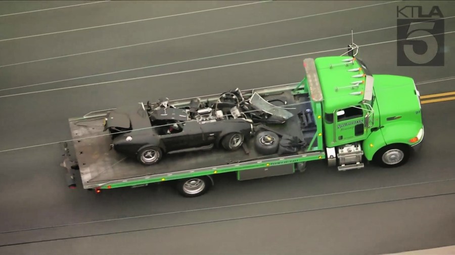 A mangled vehicle is seen being towed after a deadly crash in Temple City early Sept. 16, 2021. (KTLA)