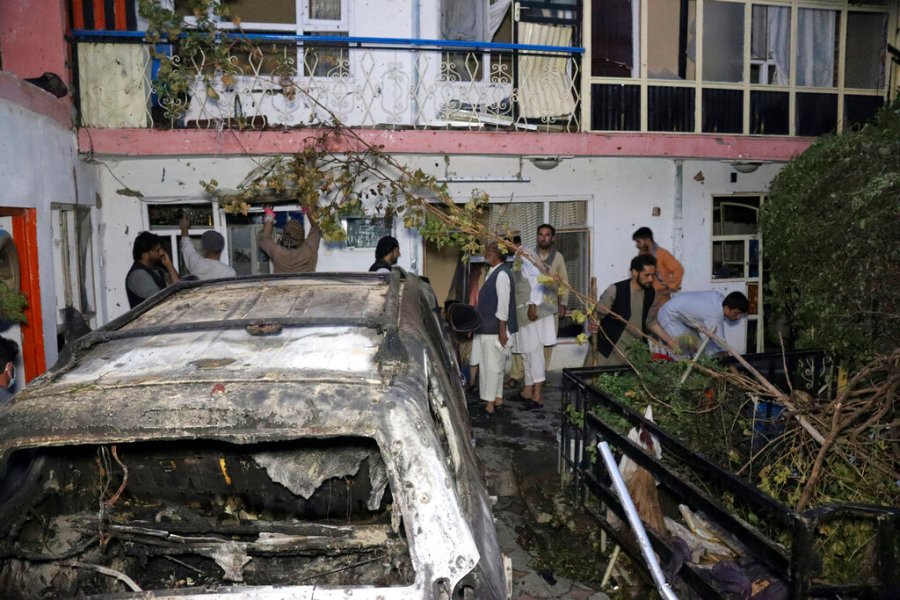 In this Sunday, Aug. 29, 2021 file photo, Afghans inspect damage of Ahmadi family house after U.S. drone strike in Kabul, Afghanistan. (AP Photo/Khwaja Tawfiq Sediqi, File)