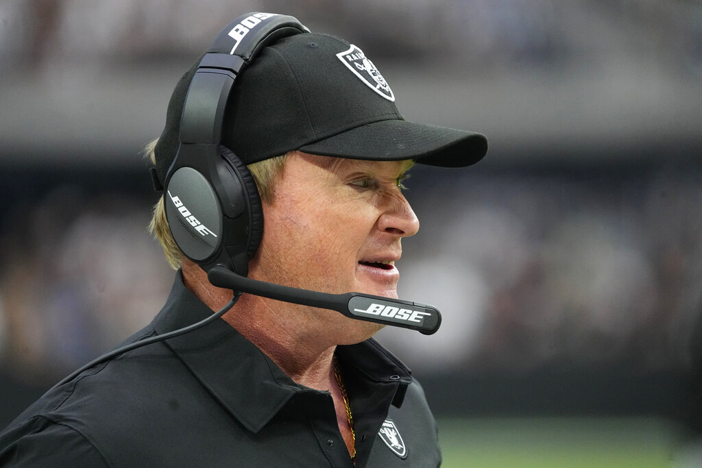 Las Vegas Raiders head coach Jon Gruden stands on the sidelines during the first half of an NFL football game against the Miami Dolphins, Sunday, Sept. 26, 2021, in Las Vegas. (AP Photo/Rick Scuteri)