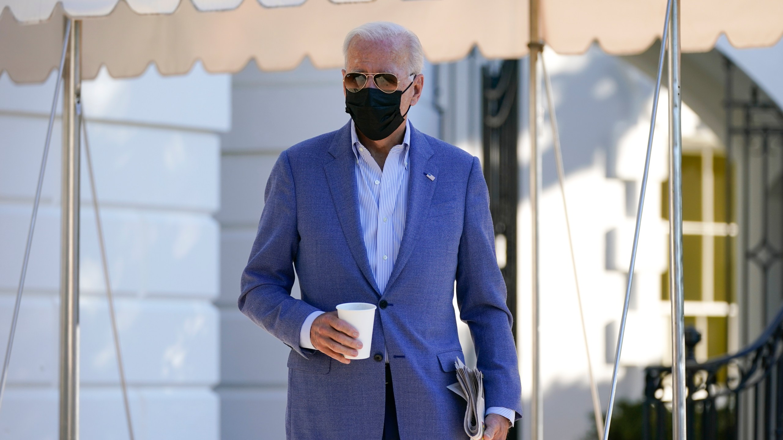 President Joe Biden walks over to speak with members of the press before boarding Marine One on the South Lawn of the White House, Saturday, Oct. 2, 2021, in Washington. Biden is spending the weekend at his home in Delaware. (AP Photo/Patrick Semansky)