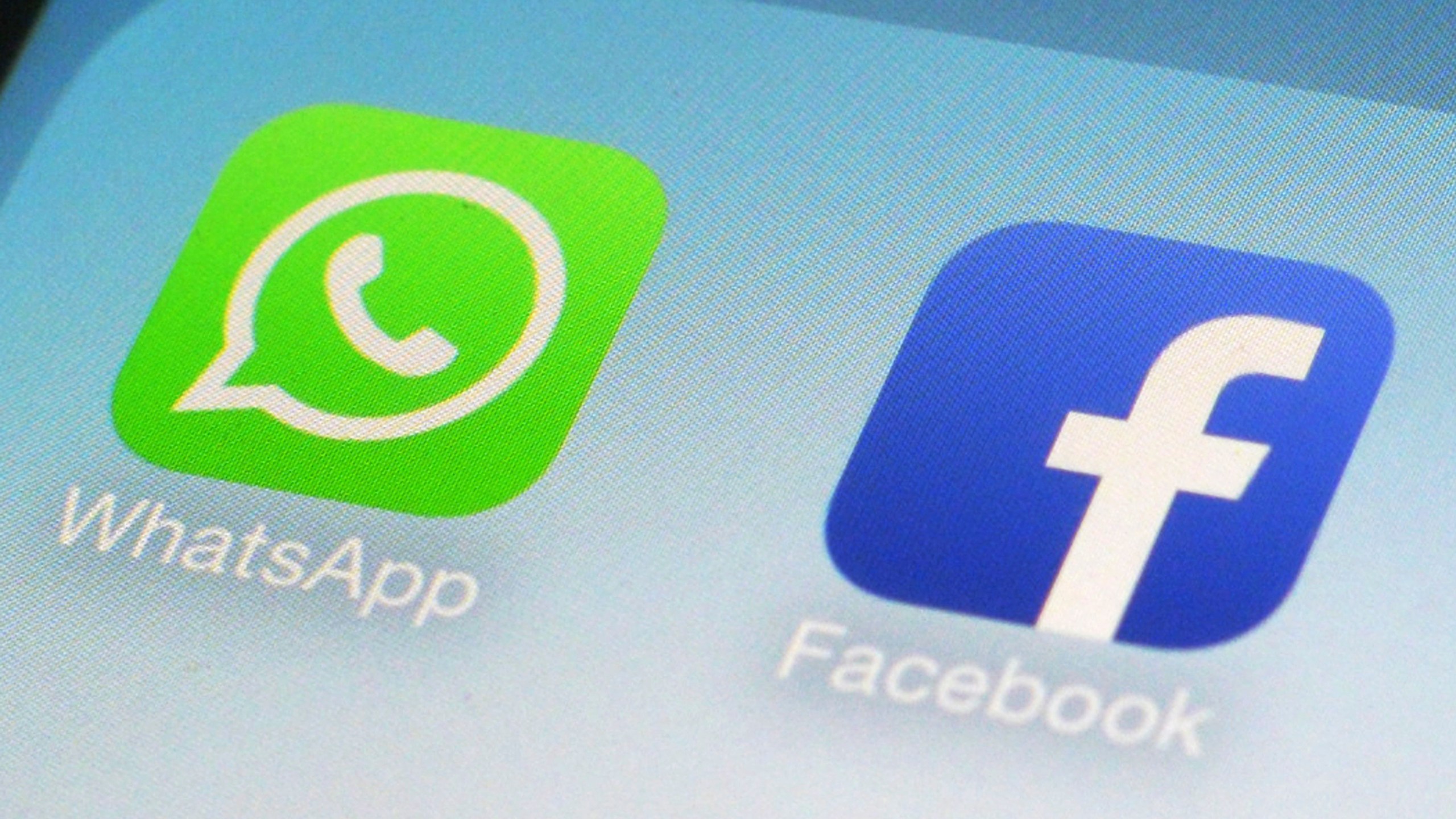 This Feb. 19, 2014, file photo, shows WhatsApp and Facebook app icons on a smartphone in New York. Facebook and its Instagram and WhatsApp platforms were down in parts of the world on Monday, Oct. 4, 2021. The company said it was “aware that some people are having trouble accessing Facebook app" and it was working on restoring access. (AP Photo/Patrick Sison, File)