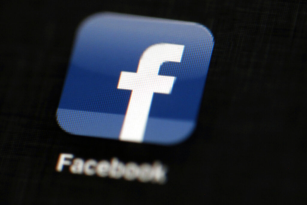 In this May 16, 2012, file photo, the Facebook logo is displayed on an iPad in Philadelphia. (AP Photo/Matt Rourke, File)