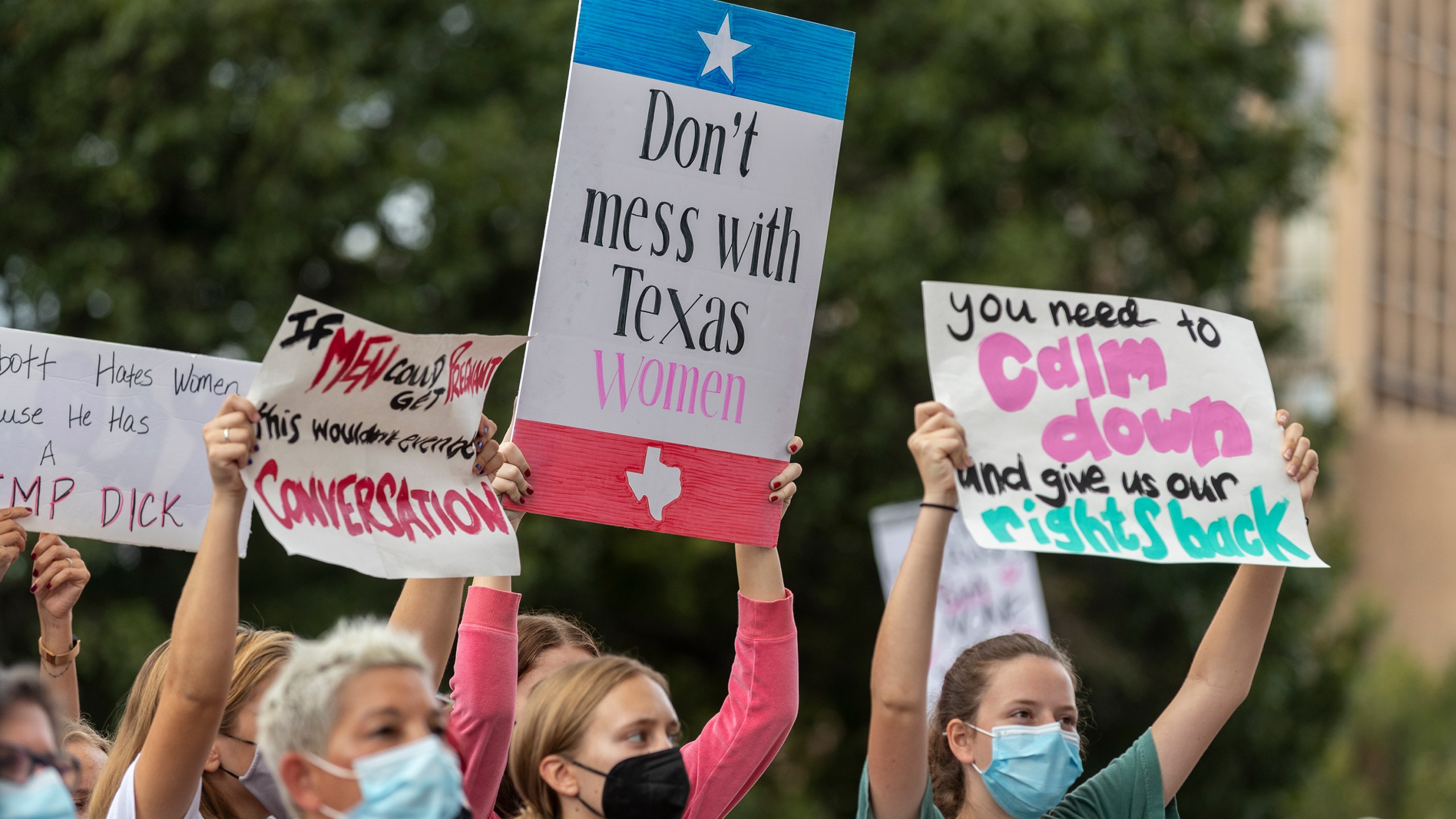 In this Oct. 2, 2021, file photo, people attend the Women's March ATX rally, at the Texas State Capitol in Austin, Texas. (AP Photo/Stephen Spillman, File)