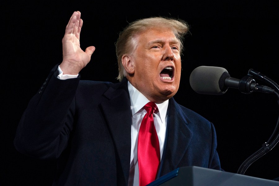 In this Dec. 5, 2020, file photo, President Donald Trump speaks at a campaign rally for Senate Republican candidates in Valdosta, Ga. A report by the Senate Judiciary Committee's Democratic majority details Trump's extraordinary effort to overturn the 2020 presidential election that he lost. His pursuit of fraud claims brought the Justice Department to the brink of chaos and prompted top officials there and at the White House to threaten to resign. (AP Photo/Evan Vucci, File)