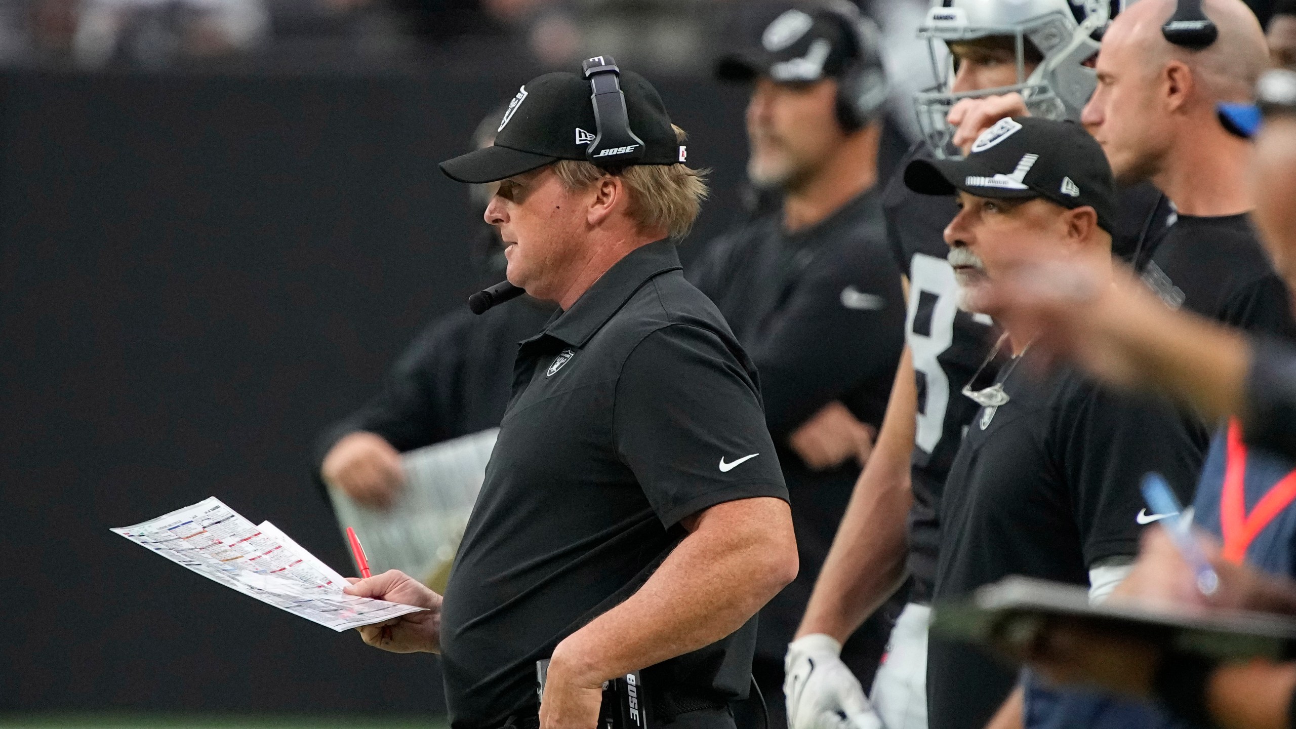 Las Vegas Raiders head coach Jon Gruden watches from the sideline during the second half of an NFL football game against the Chicago Bears, Sunday, Oct. 10, 2021, in Las Vegas. (AP Photo/Rick Scuteri)