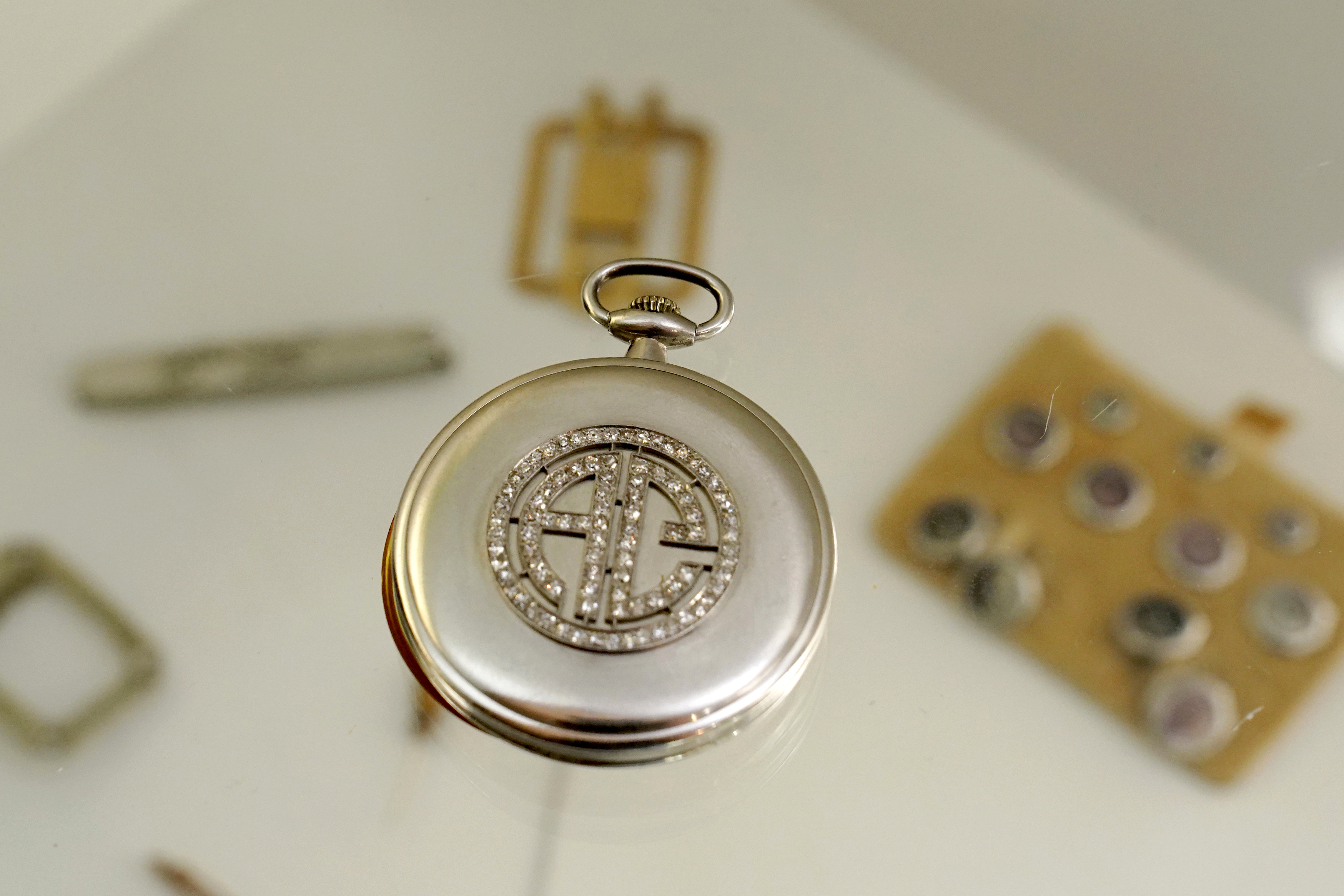 A platinum and diamond Patek Philippe pocket watch with the initials AC that once belonged to mob boss Al Capone is displayed at Witherell's Auction House in Sacramento on Aug. 25, 2021. (Rich Pedroncelli / Associated Press)