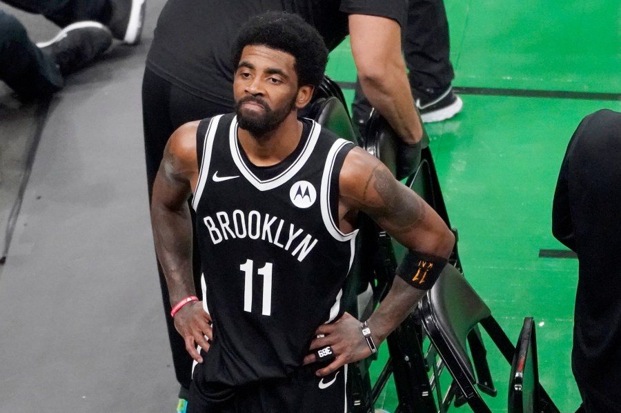 Brooklyn Nets guard Kyrie Irving looks up at the fans at TD Garden after they defeated the Boston Celtics in Game 4 during an NBA basketball first-round playoff series in Boston, in this Sunday, May 30, 2021, file photo. (AP Photo/Elise Amendola, File)