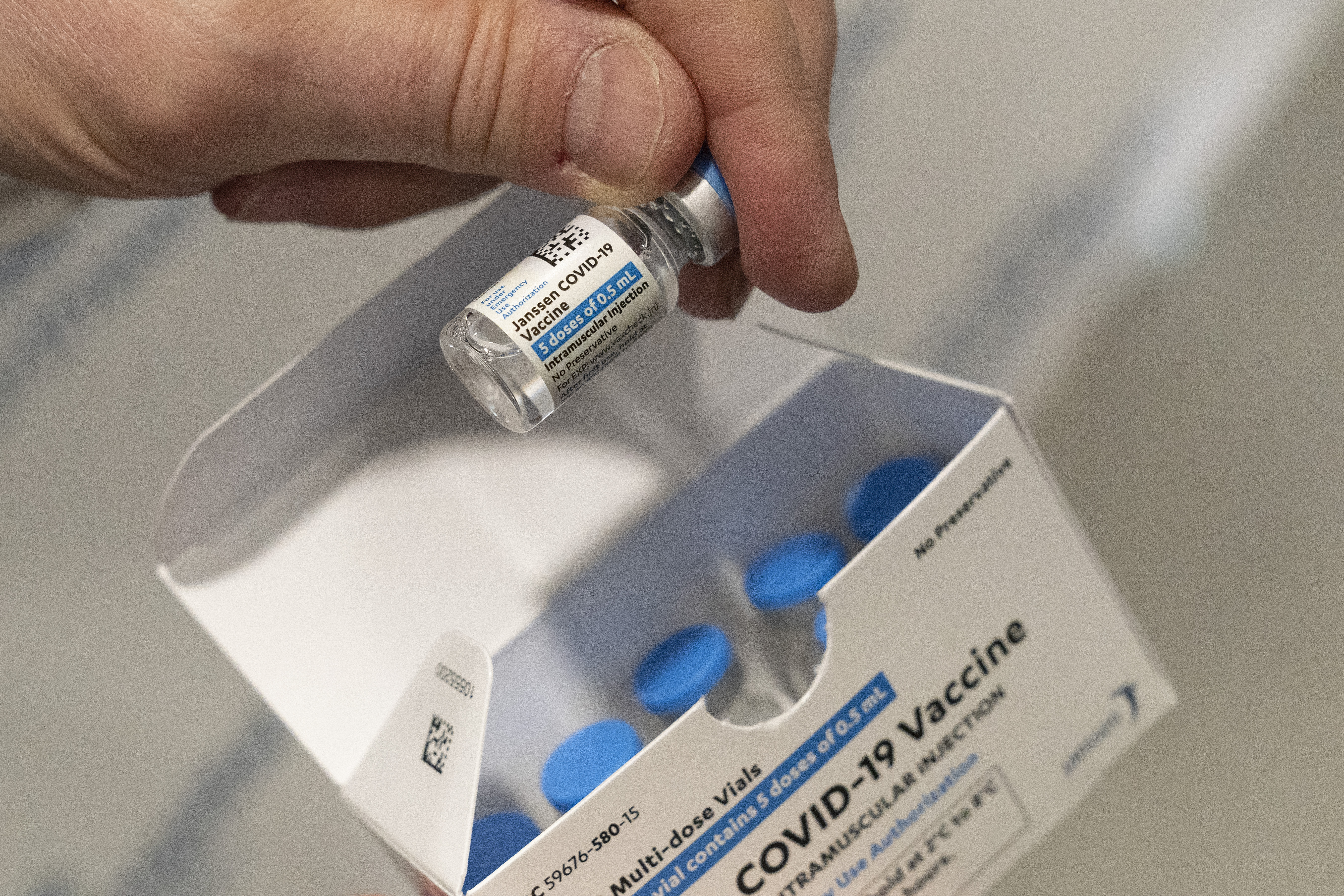 In this March 3, 2021 file photo, a pharmacist holds a vial of the Johnson & Johnson COVID-19 vaccine at a hospital in Bay Shore, N.Y. (Mark Lennihan/Associated Press)