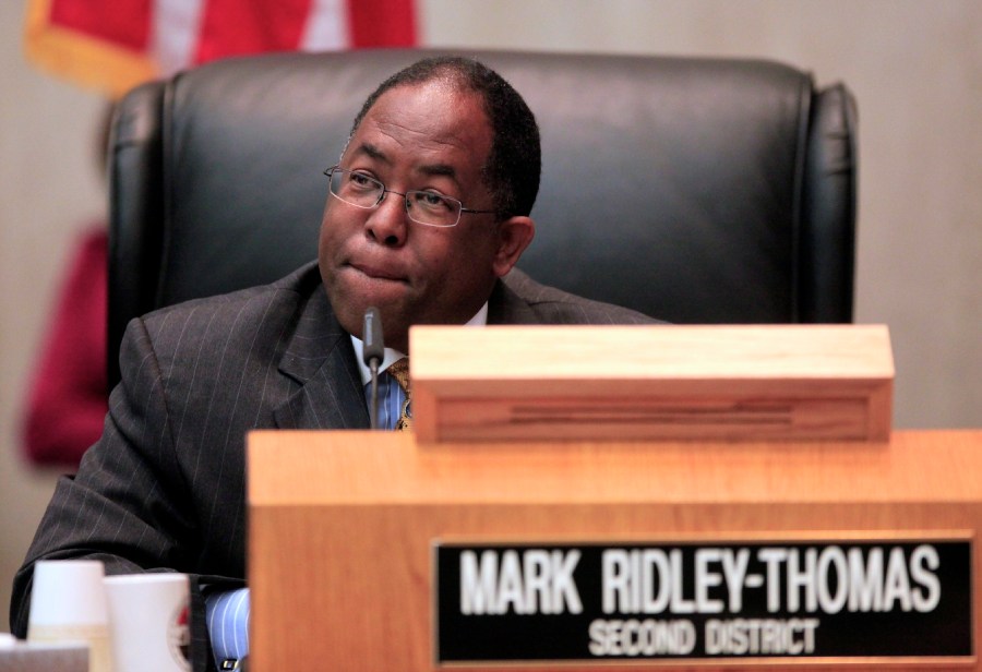 In this Jun 1, 2010, photo, Los Angeles County Supervisor Mark Ridley-Thomas casts the deciding vote for the Board of Supervisors 3-2 vote to join the city in its economic boycott of Arizona over its SB 1070 law targeting illegal immigrants in Los Angeles. (AP Photo/Damian Dovarganes)