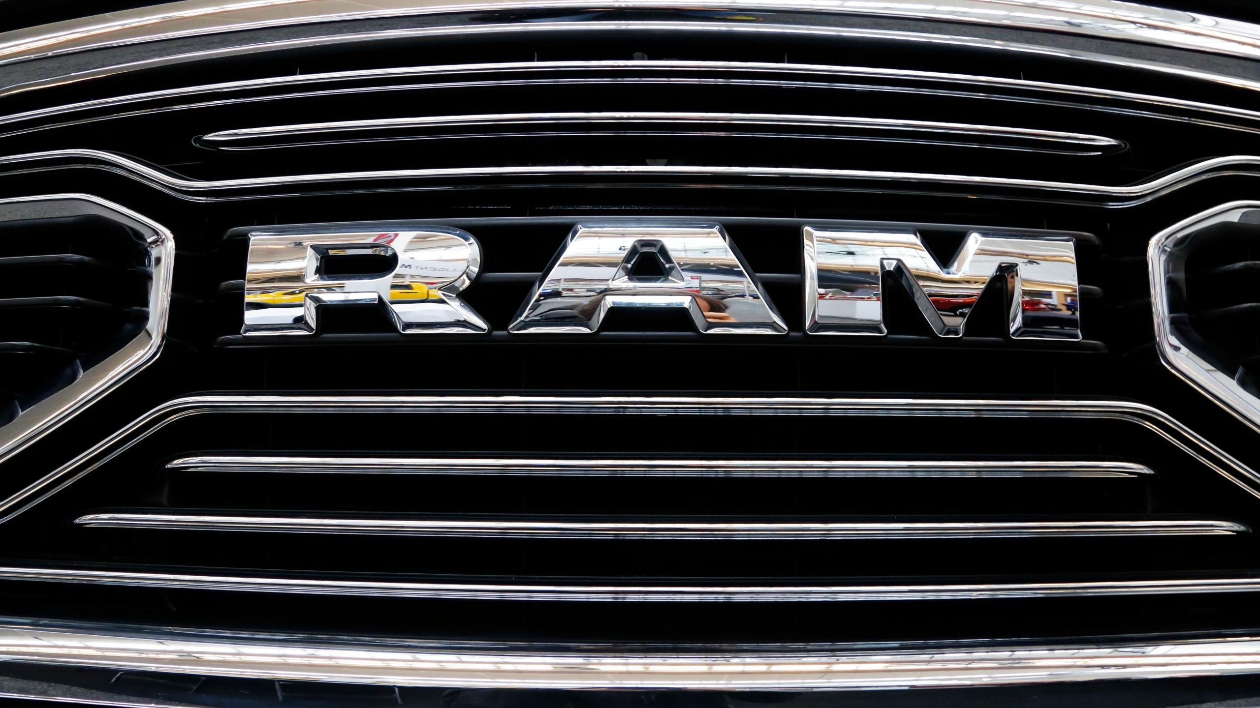 This is the grill of a 2018 Ram truck on display at the Pittsburgh Auto Show, in a Thursday, Feb. 15, 2018, file photo. U.S. safety regulators are investigating fuel pump failures in more than 600,000 diesel Ram trucks that could cause the engines to stall or lose power. The National Highway Traffic Safety Administration says in documents posted on its website Monday, Oct. 18, 2021, that it received 22 complaints and two field reports of engines stalling due to high-pressure fuel pumps failing.(AP Photo/Gene J. Puskar, File)