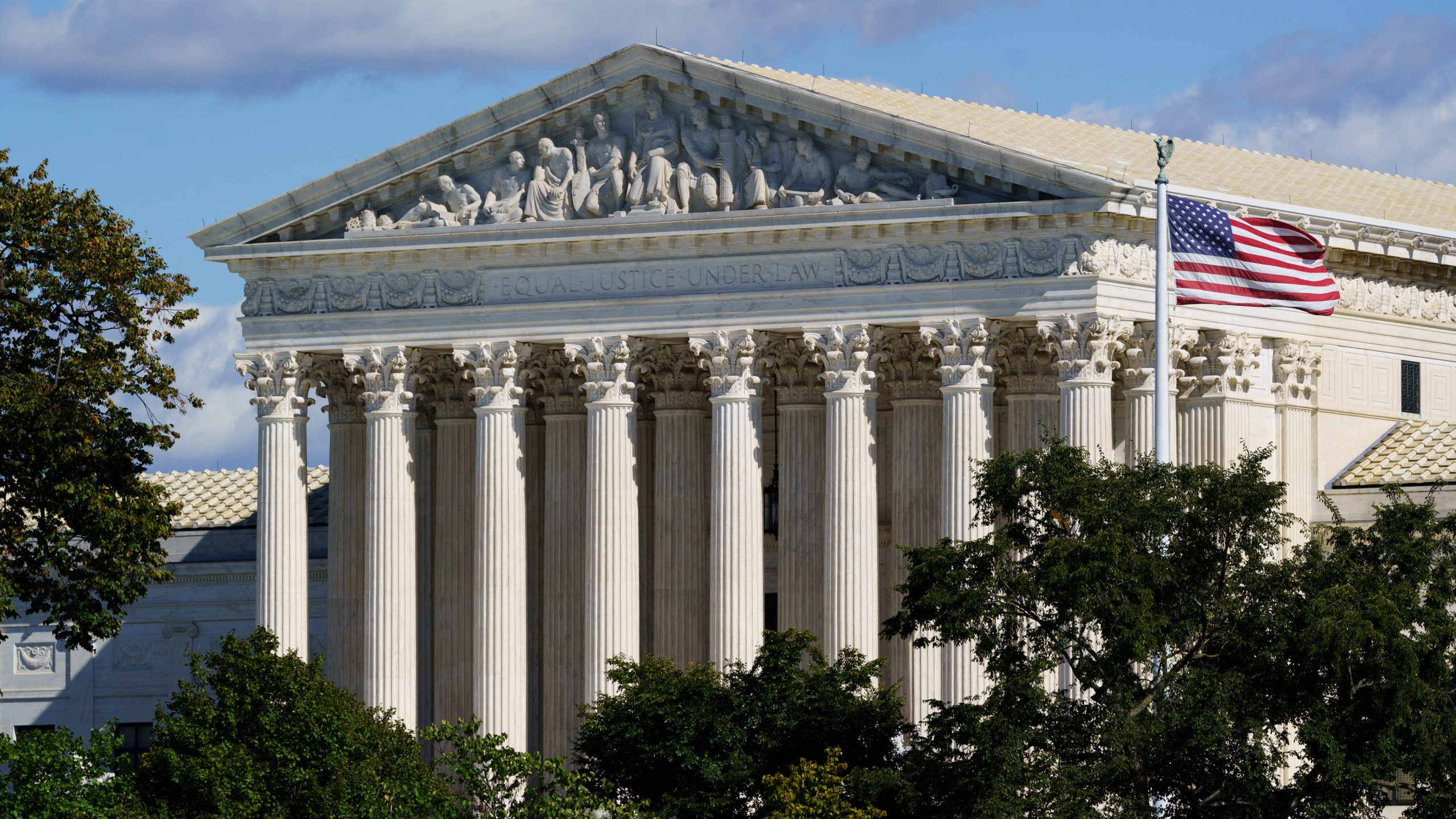 In this Oct. 18, 2021 photo, the Supreme Court is seen in Washington. Texas is urging the Supreme Court to leave in place its law banning most abortions and telling the justices there’s no reason to rush into the case. The state filed its response Thursday to the Biden administration’s call on the high court to block the law and rule conclusively this term on the measure’s constitutionality. (AP Photo/J. Scott Applewhite)