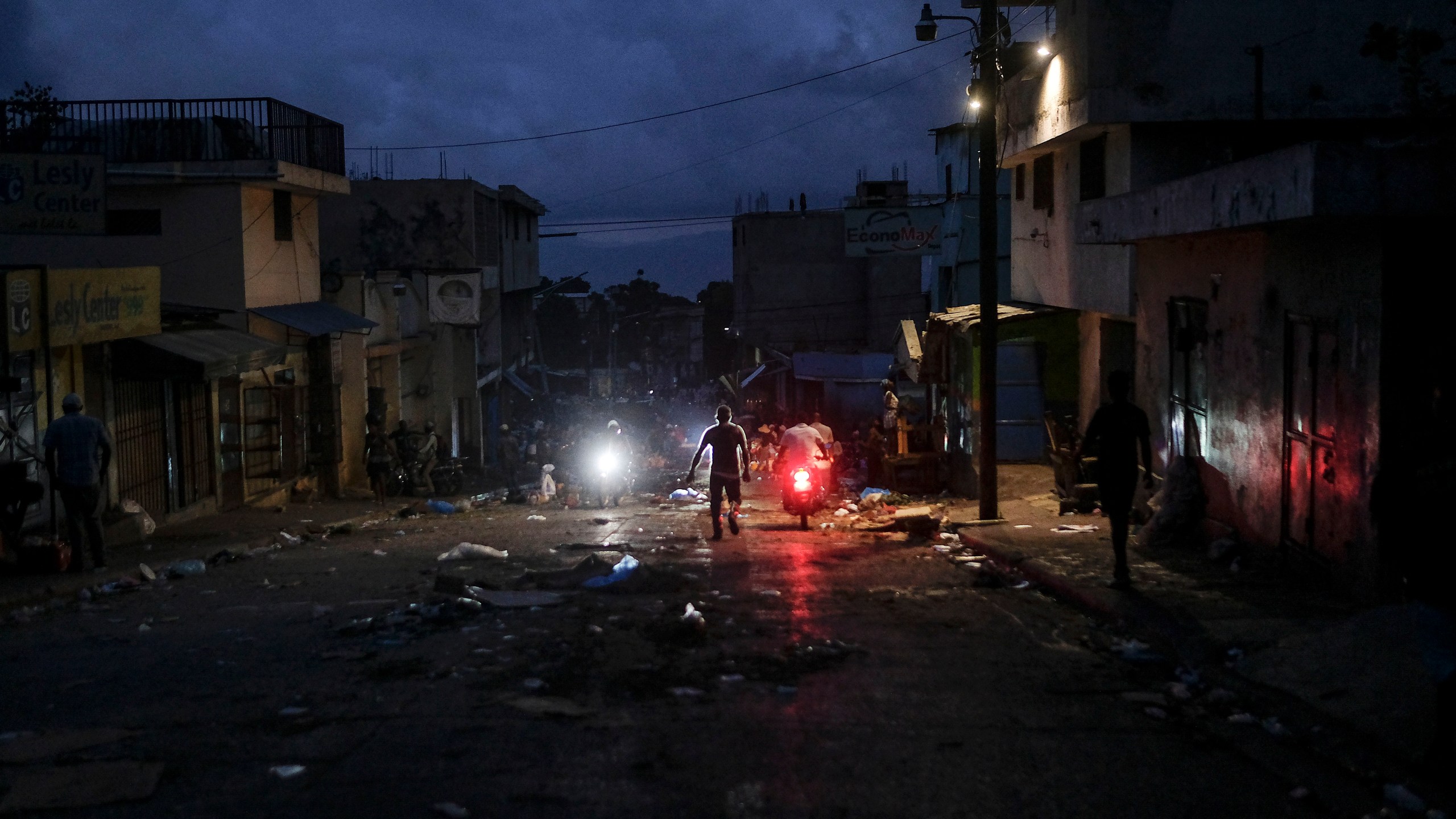 A man walks through the Petion-Ville market during a general strike in Port-au-Prince, Monday, Oct. 18, 2021. (AP Photo/Matias Delacroix)