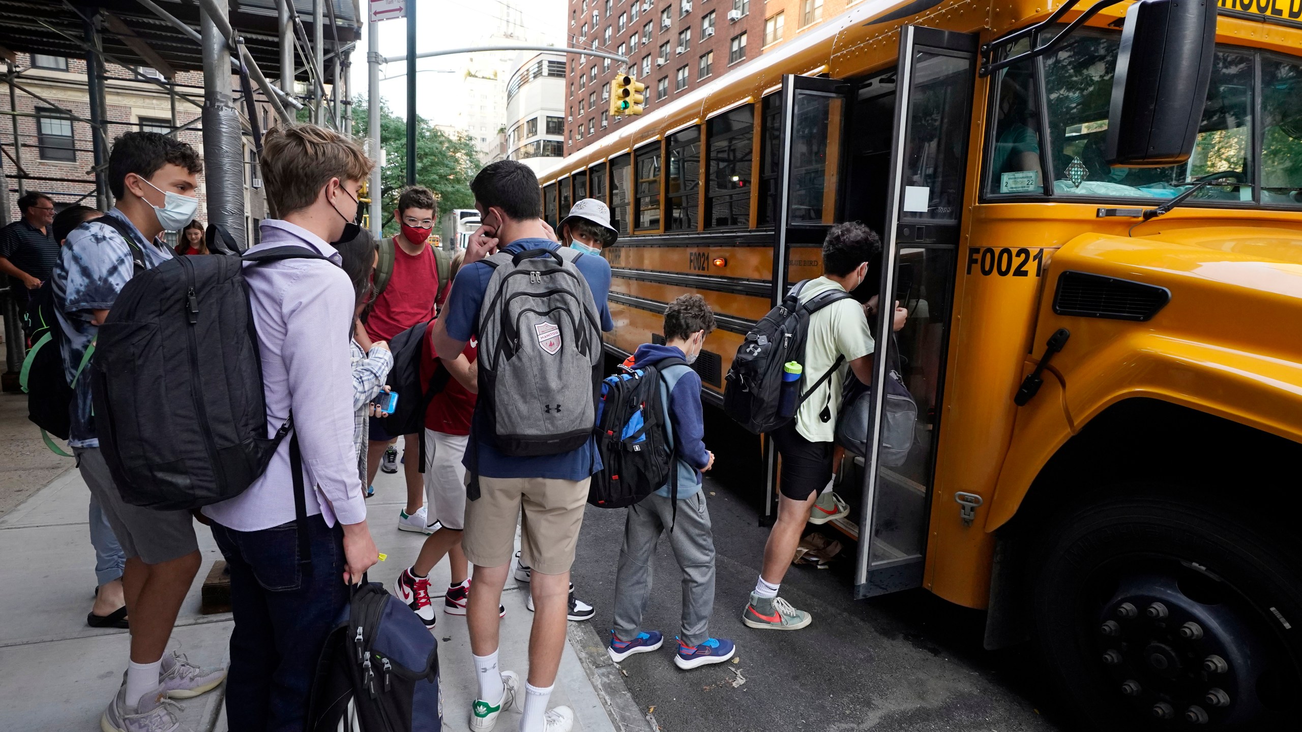 In this Sept. 13, 2021, file photo, students board a school bus on New York's Upper West Side. (AP Photo/Richard Drew, File)