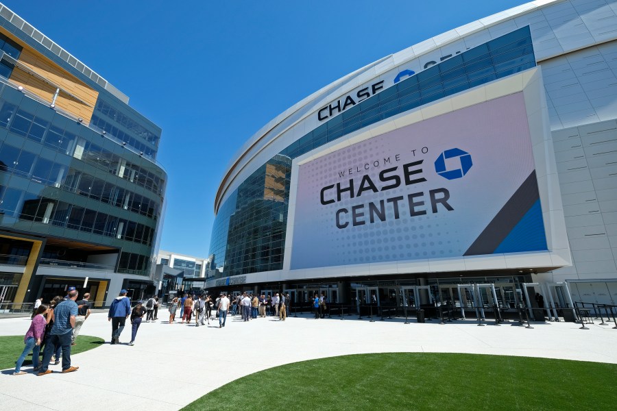 In this Aug. 26, 2019, file photo, people walk outside the Chase Center in San Francisco. (Eric Risberg/Associated Press)