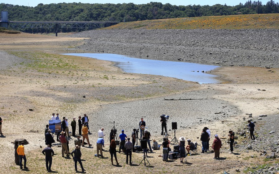 In this April 21, 2021, file photo, California Gov. Gavin Newsom holds a news conference in the parched basin of Lake Mendocino in Ukiah, Calif., where he announced he would proclaim a drought emergency for Mendocino and Sonoma counties. (Kent Porter/The Press Democrat via AP, File)