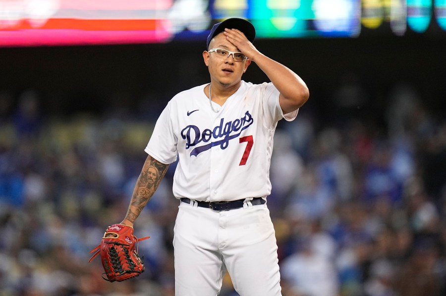 Los Angeles Dodgers pitcher Julio Urias reacts after giving up an RBI single to Atlanta Braves' Joc Pederson during the third inning in Game 4 of baseball's National League Championship Series Wednesday, Oct. 20, 2021, in Los Angeles. (AP Photo/Jae Hong)