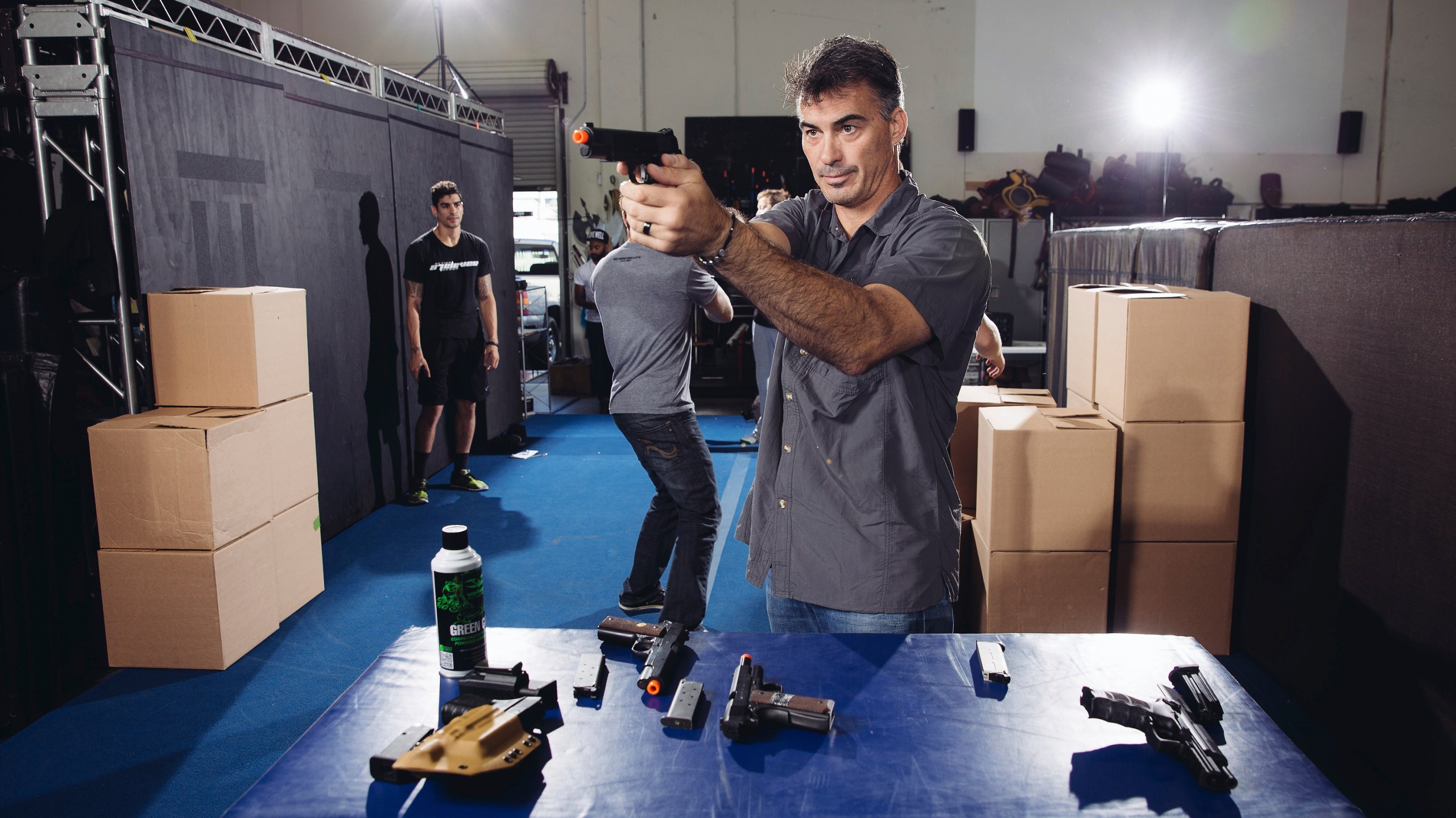 In this Oct. 7, 2014 photo, Chad Stahelski, co-director of the film, "John Wick," demonstrates proper gun handling during a training session at 87Eleven Action Design in Inglewood, Calif. (Photo by Casey Curry/Invision/AP, File)