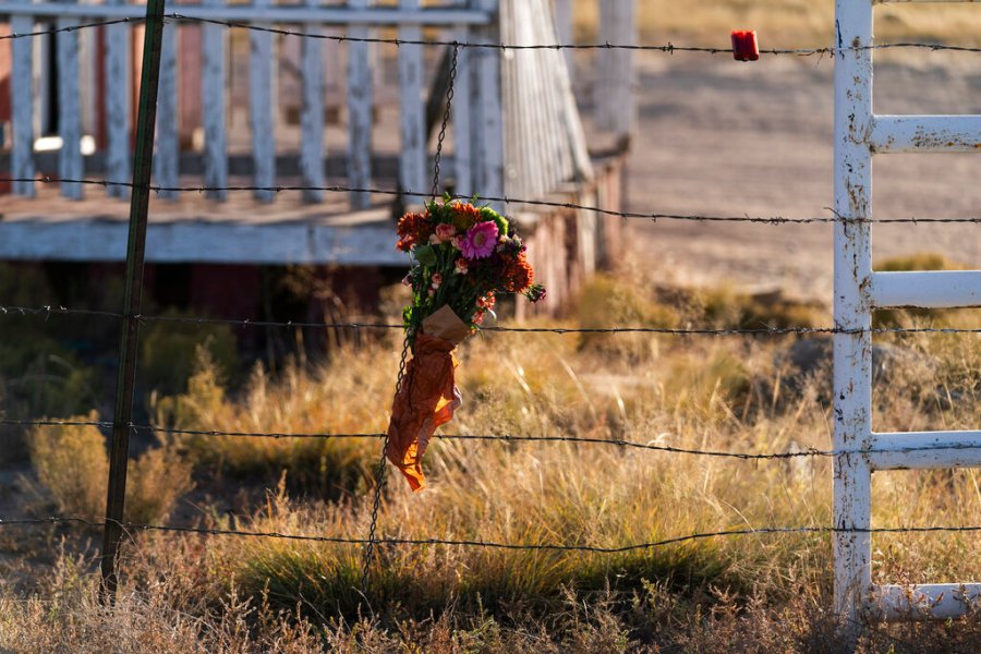 A bouquet of flowers is left to honor cinematographer Halyna Hutchins outside the Bonanza Creek Ranch in Santa Fe, N.M., Sunday, Oct. 24, 2021. (AP Photo/Jae C. Hong)