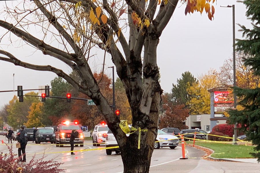 Police close off a street outside a shopping mall after a shooting in Boise, Idaho on Oct. 25, 2021. (Rebecca Boone/Associated Press)