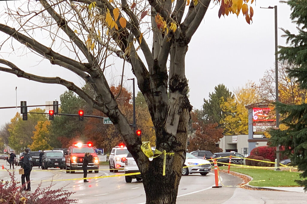 Police close off a street outside a shopping mall after a shooting in Boise, Idaho on Monday, Oct. 25, 2021. (AP Photo/Rebecca Boone)