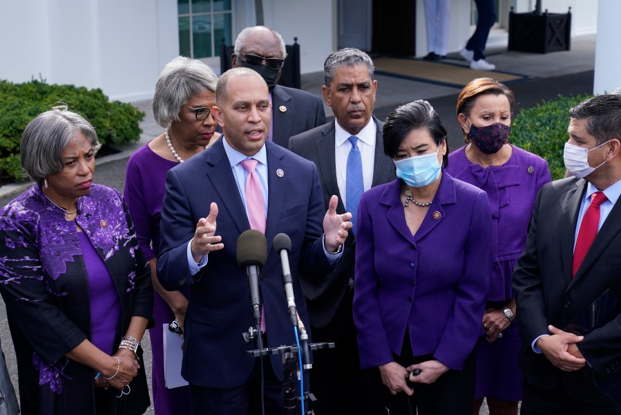 Rep. Hakeem Jeffries, D-N.Y., standing with other House Democrats, talks to reporters outside the West Wing of the White House in Washington, Tuesday, Oct. 26, 2021, following a meeting with President Joe Biden to work out details of the Biden administration's domestic agenda. (AP Photo/Susan Walsh)