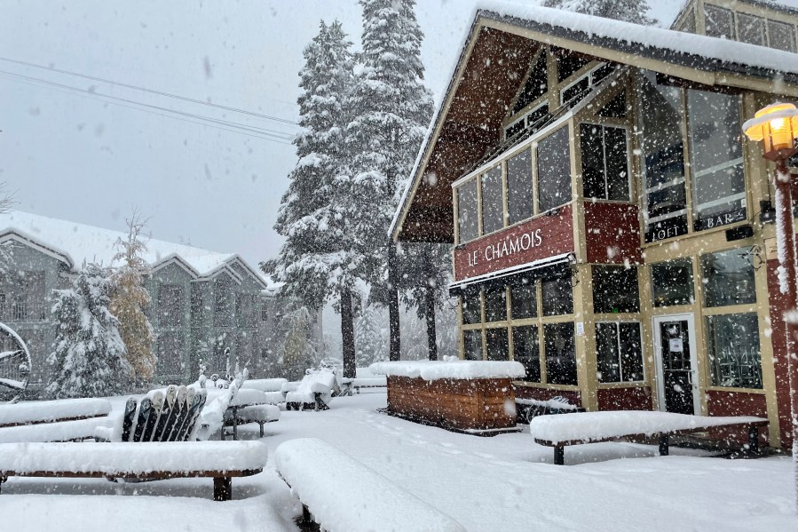 In this image taken on Oct. 25, 2021, and provided by Palisades Tahoe, snow falls at the ski resort in Olympic Valley, Calif. (Palisades Tahoe via AP)