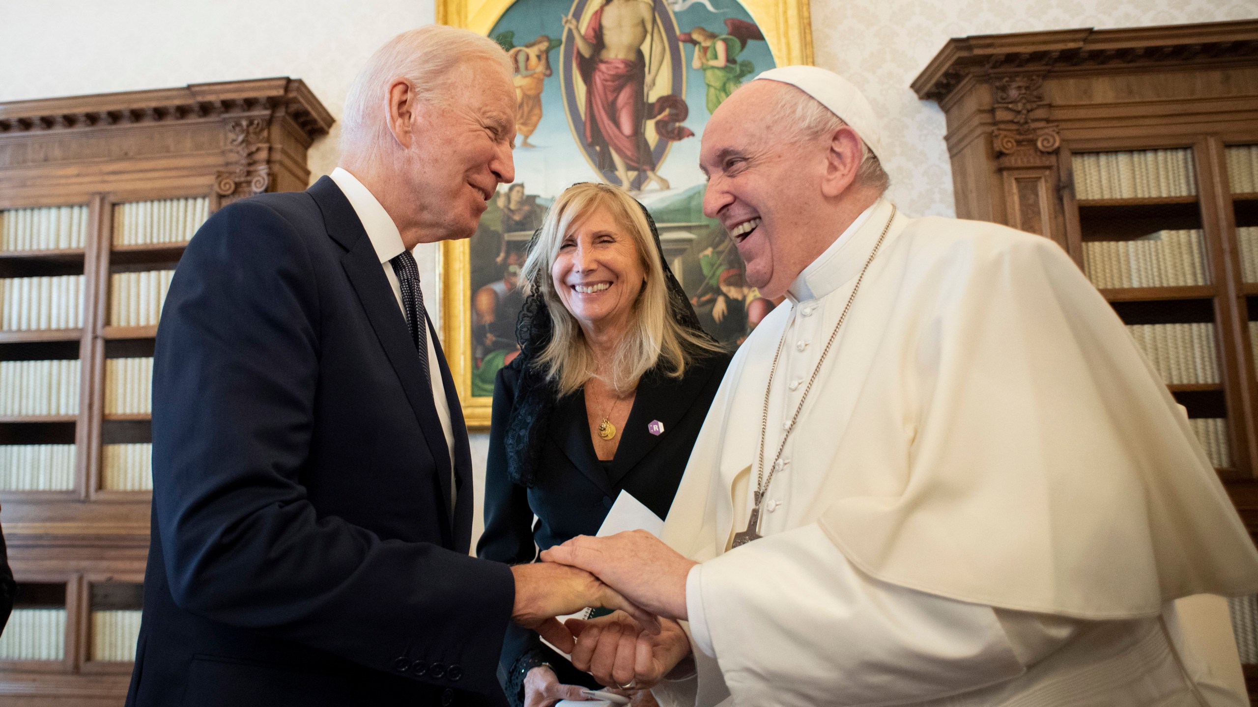 President Joe Biden, left, shakes hands with Pope Francis as they meet at the Vatican, Friday, Oct. 29, 2021. President Joe Biden is set to meet with Pope Francis on Friday at the Vatican, where the world’s two most notable Roman Catholics plan to discuss the COVID-19 pandemic, climate change and poverty. (Vatican Media via AP)