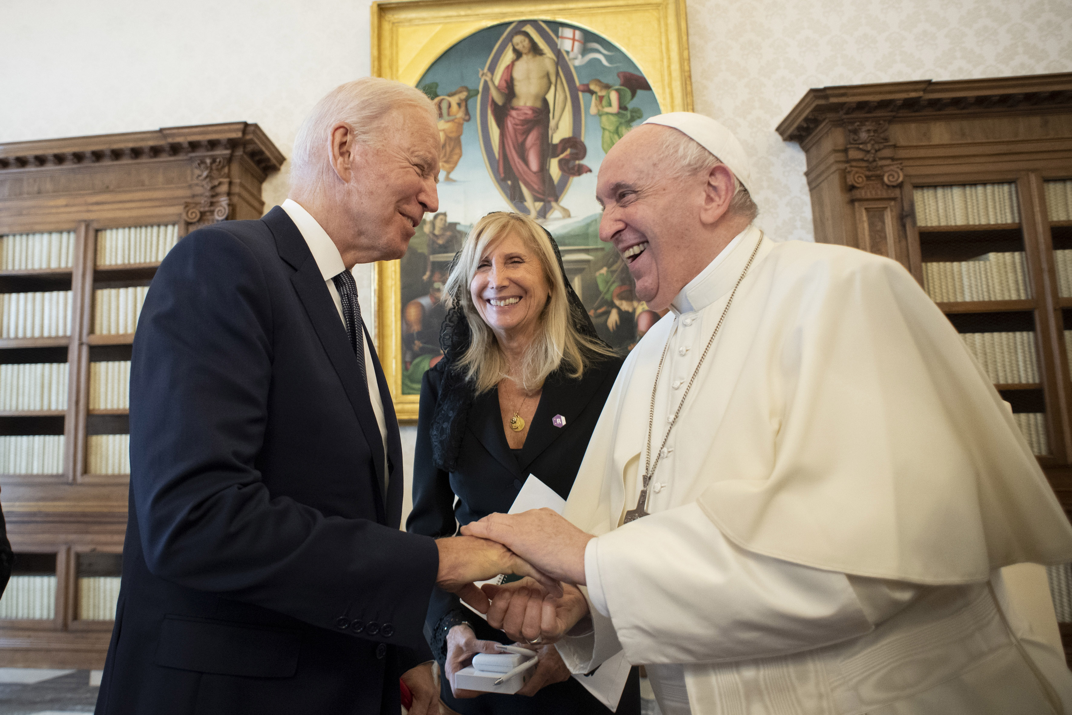 President Joe Biden, left, shakes hands with Pope Francis as they meet at the Vatican, Friday, Oct. 29, 2021. President Joe Biden is set to meet with Pope Francis on Friday at the Vatican, where the world’s two most notable Roman Catholics plan to discuss the COVID-19 pandemic, climate change and poverty. (Vatican Media via AP)