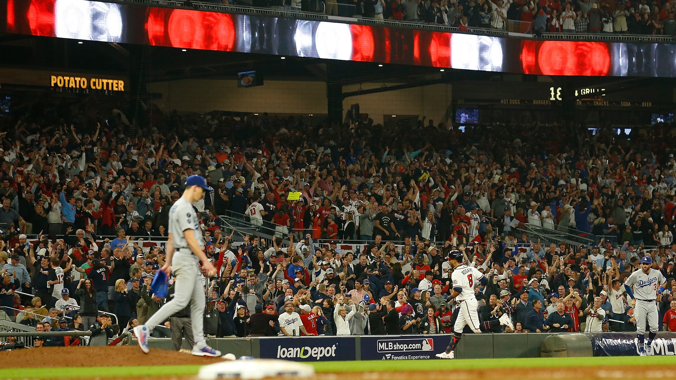 Eddie Rosario #8 of the Atlanta Braves runs the bases following a three run home run during the fourth inning of Game Six of the National League Championship Series against the Los Angeles Dodgers at Truist Park on Oct. 23, 2021, in Atlanta, Georgia. (Michael Zarrilli/Getty Images)