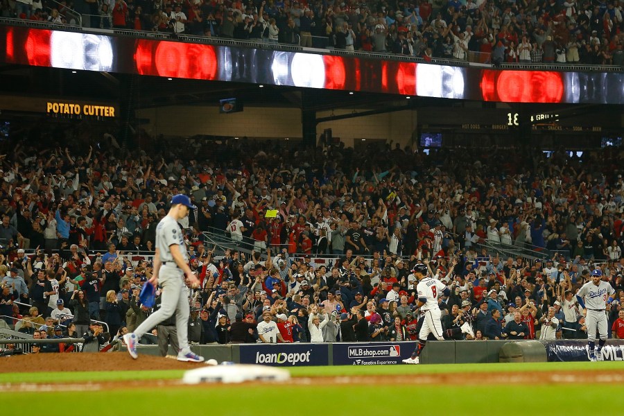 Eddie Rosario #8 of the Atlanta Braves runs the bases following a three run home run during the fourth inning of Game Six of the National League Championship Series against the Los Angeles Dodgers at Truist Park on Oct. 23, 2021, in Atlanta, Georgia. (Michael Zarrilli/Getty Images)