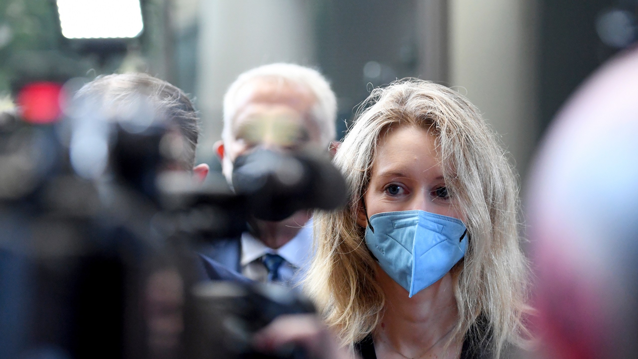 In this Tuesday, Aug. 31, 2021, file photo, Elizabeth Holmes, founder and CEO of Theranos, arrives at the federal courthouse for jury selection in her trial, in San Jose, Calif. A jury weighing the fate of fallen Silicon Valley star Holmes got its first chance Friday, Oct. 22, to listen to recordings of her boasting to investors about purported breakthroughs in a blood-testing technology. (AP Photo/Nic Coury)