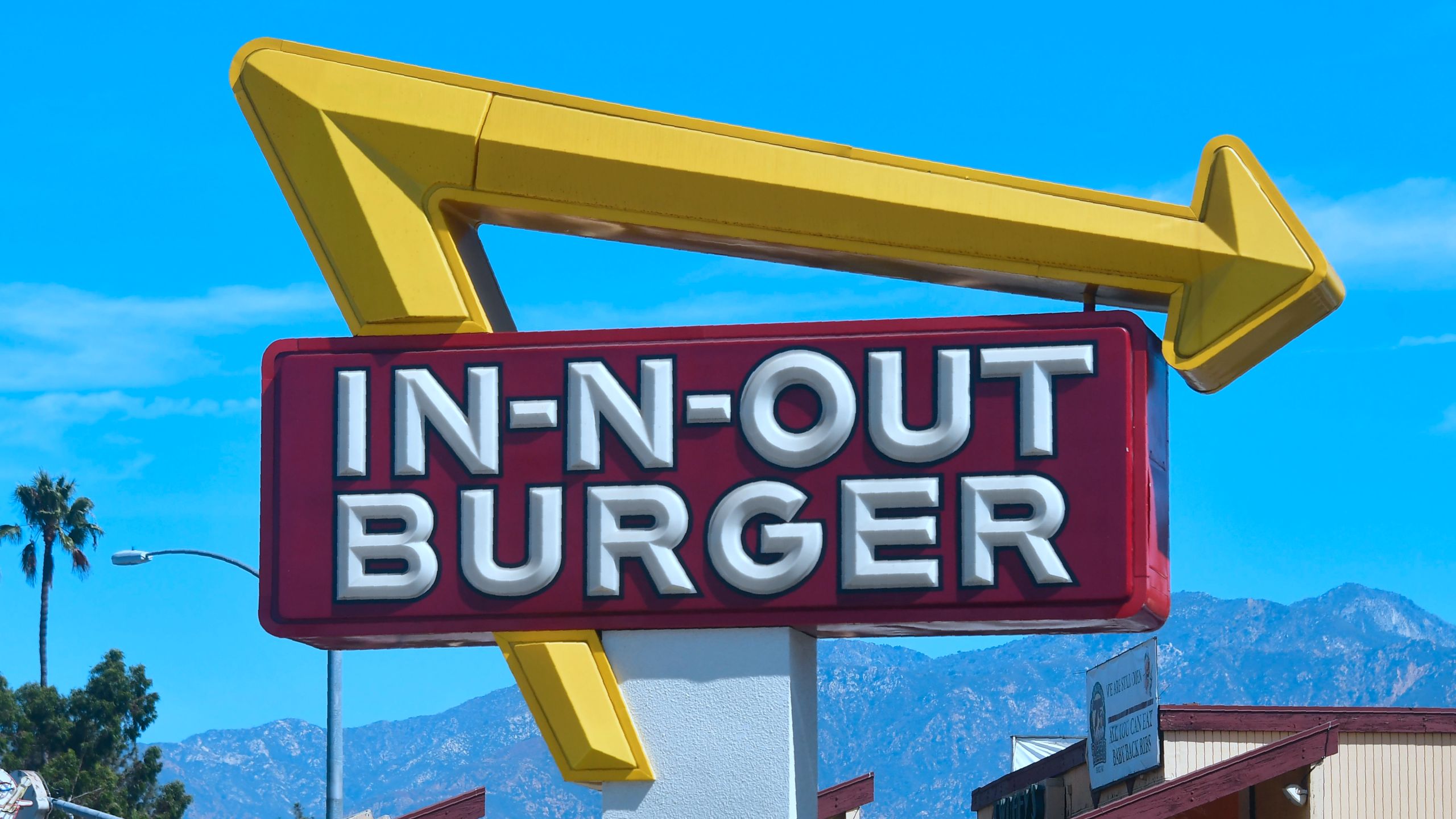 The signs points to an In-N-Out Burger restaurant in Alhambra on Aug. 30, 2018. (FREDERIC J. BROWN/AFP via Getty Images)