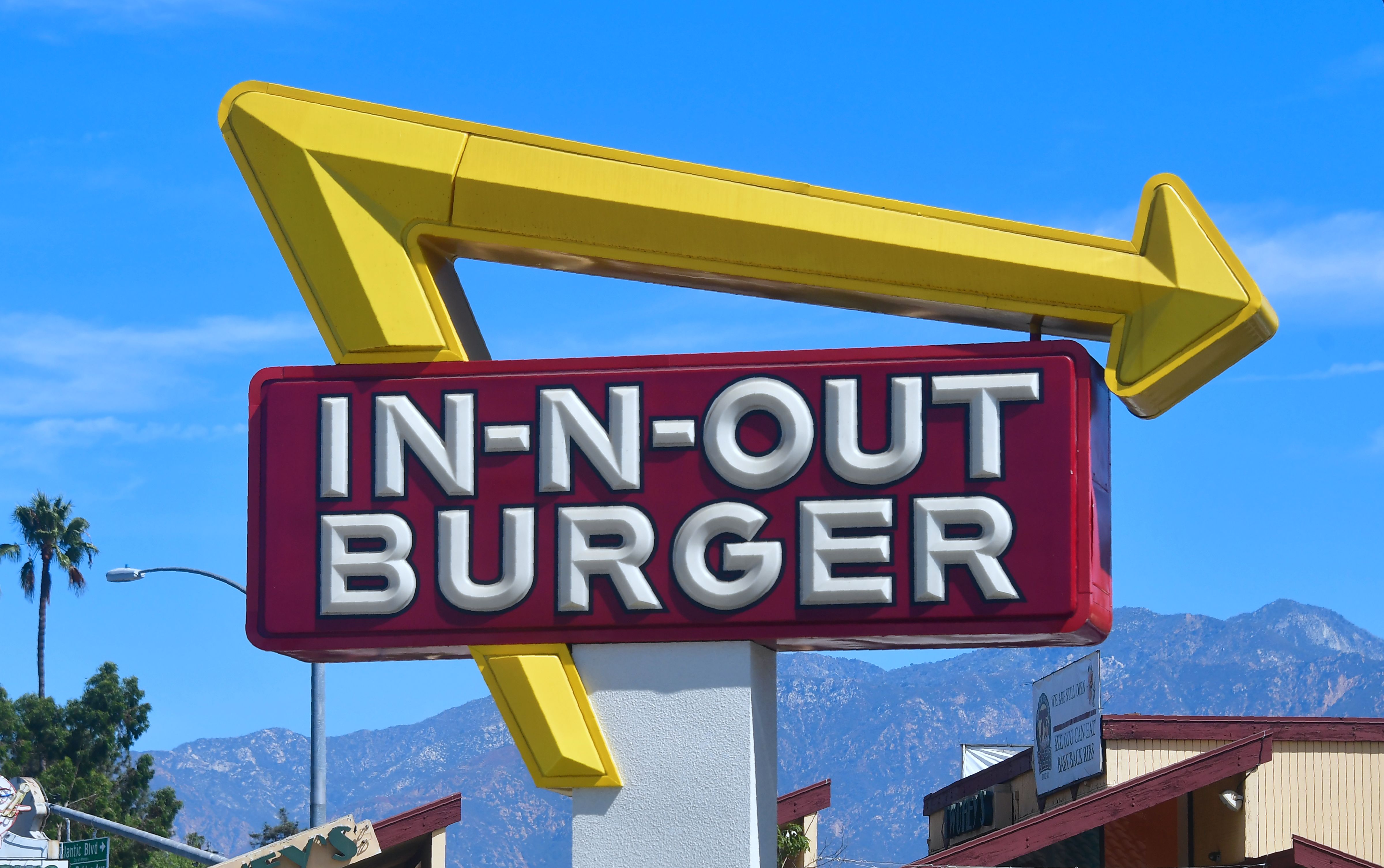 The signs points to an In-N-Out Burger restaurant in Alhambra on Aug. 30, 2018. (FREDERIC J. BROWN/AFP via Getty Images)