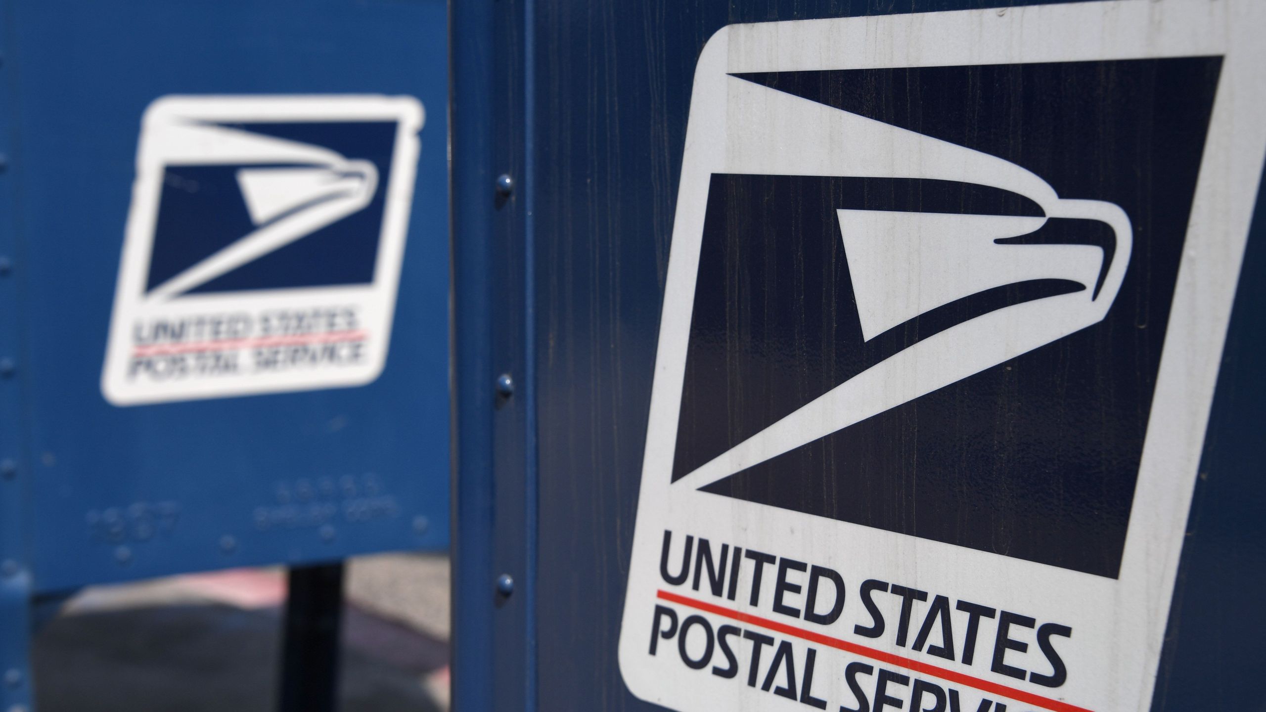 The United States Postal Service logo is seen on a mailbox outside a post office in Los Angeles, California, August 17, 2020. (ROBYN BECK/AFP via Getty Images)